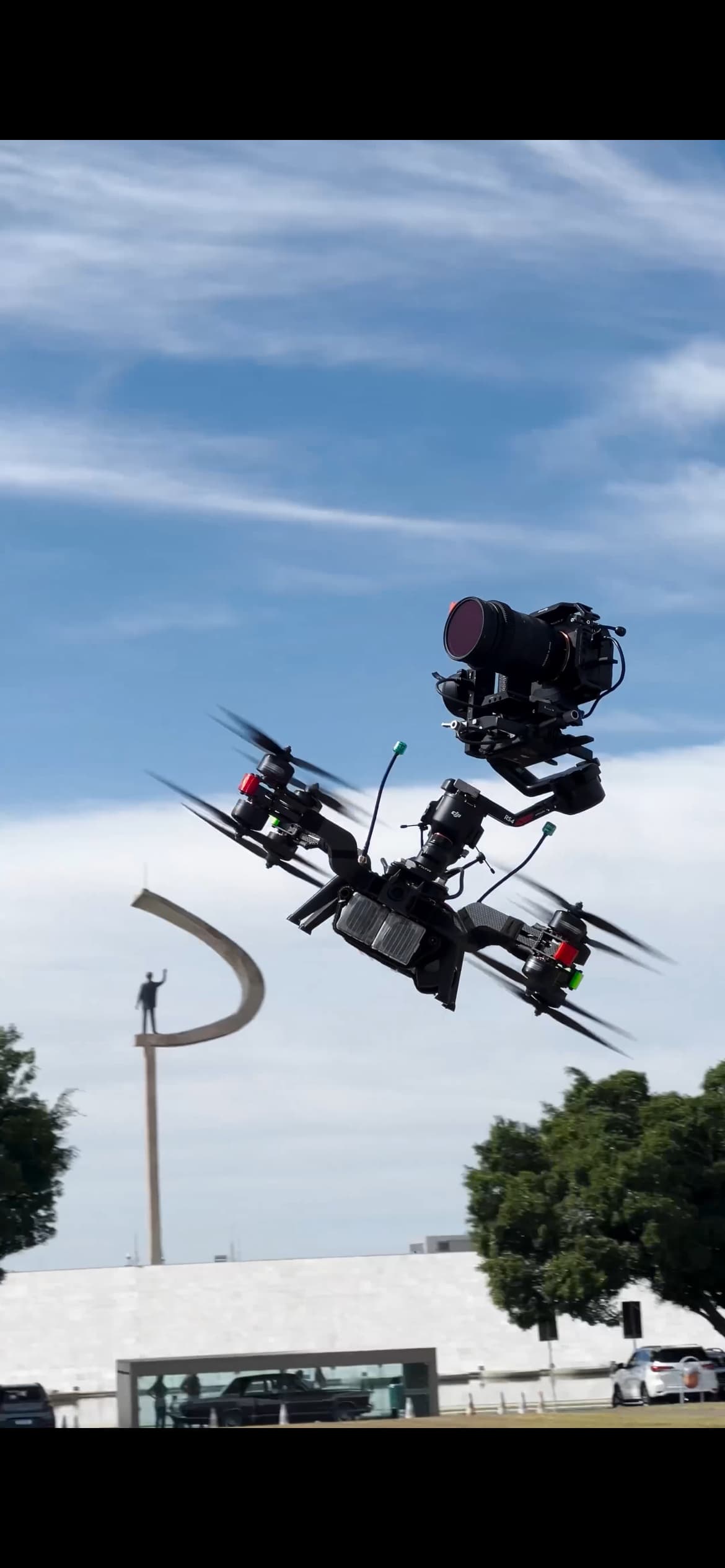 A heavy-lift cinelifter drone with a cinema camera mounted.